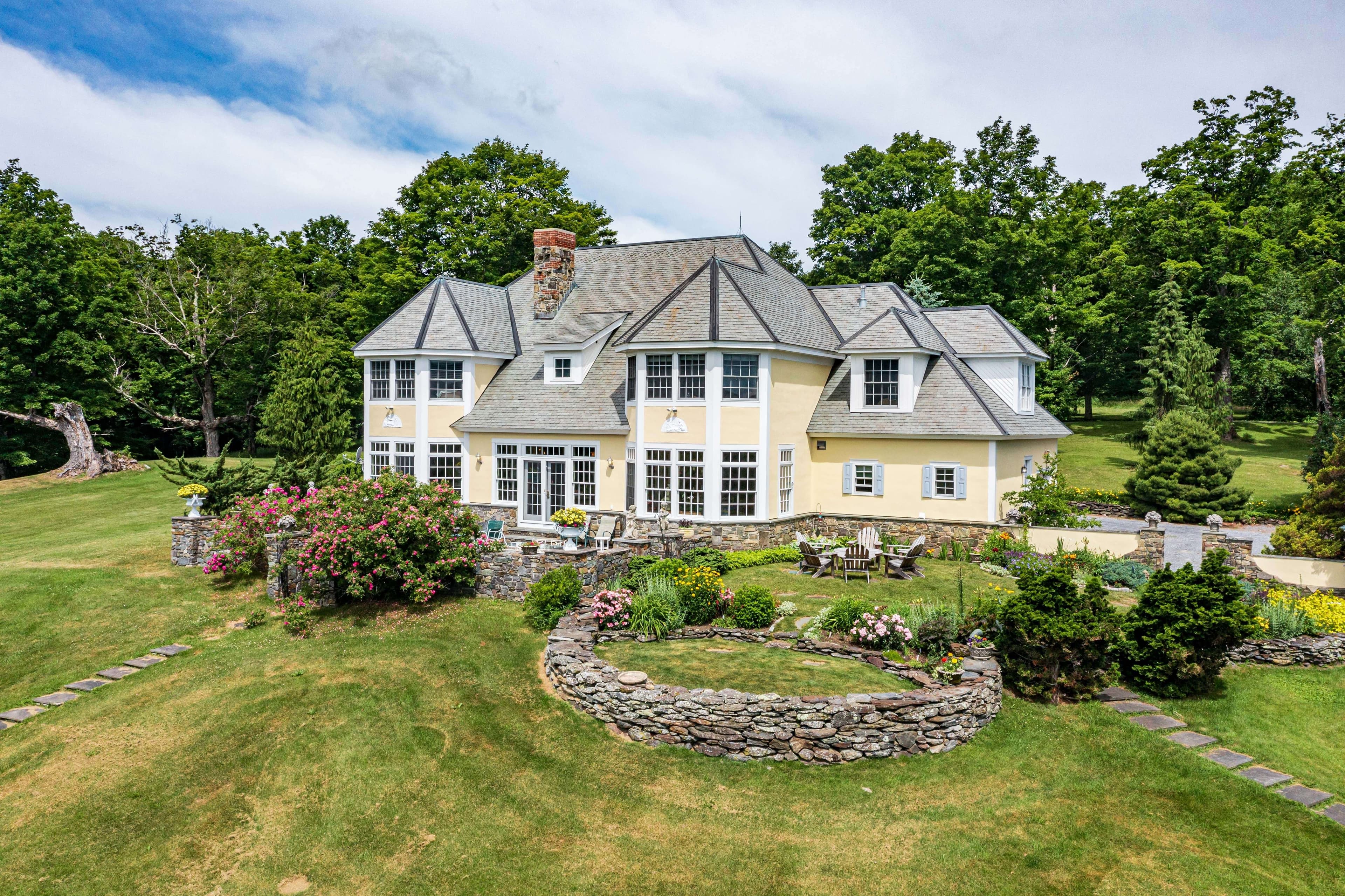 large yellow mansion in countryside